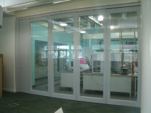 Closed Glass Wall Partitions seperating hallway and technician room