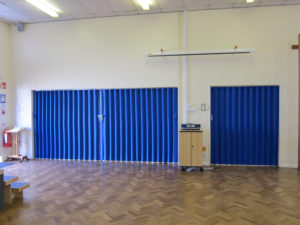 Blue Concertina Walls Closed In School